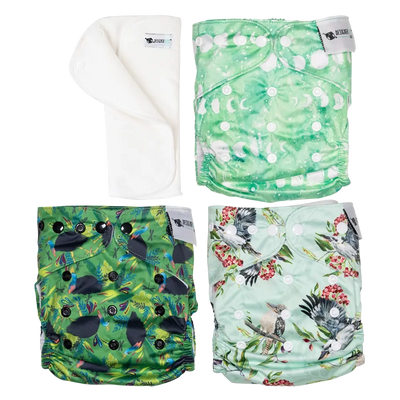 Four colorful patterned cloth diapers on a white background