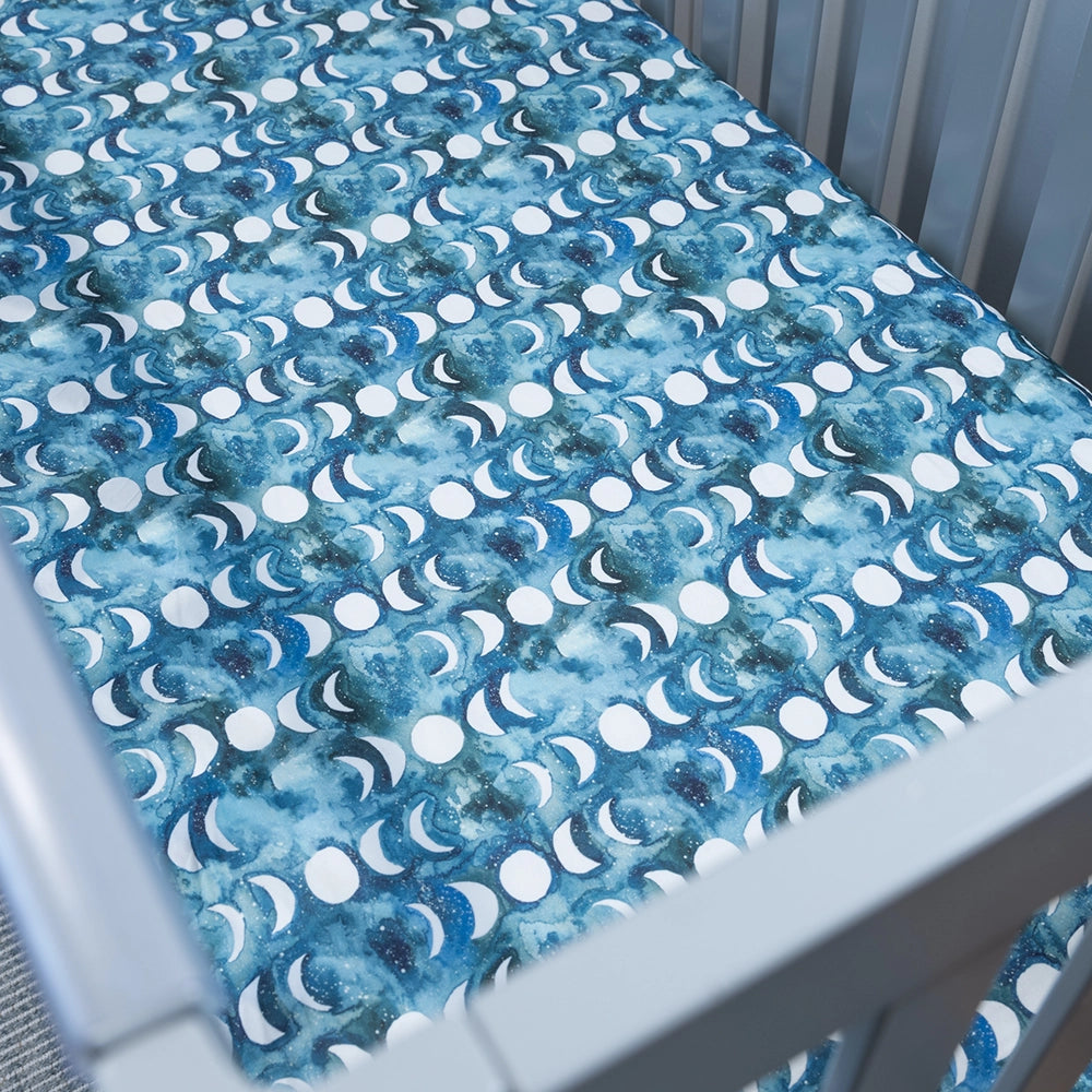 Transformative Teal Moon Fitted Cot Sheet