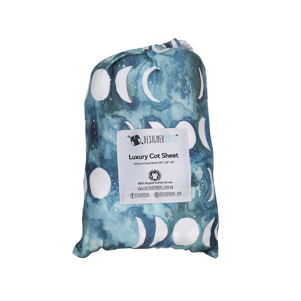 Transformative Teal Moon Fitted Cot Sheet